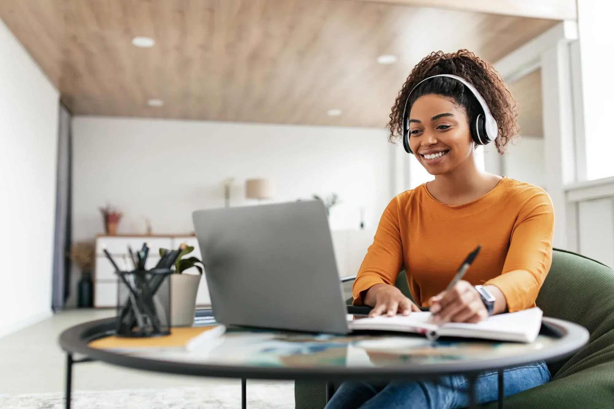 Person studying at a laptop desk.