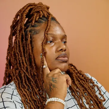 Person with long, styled hair.